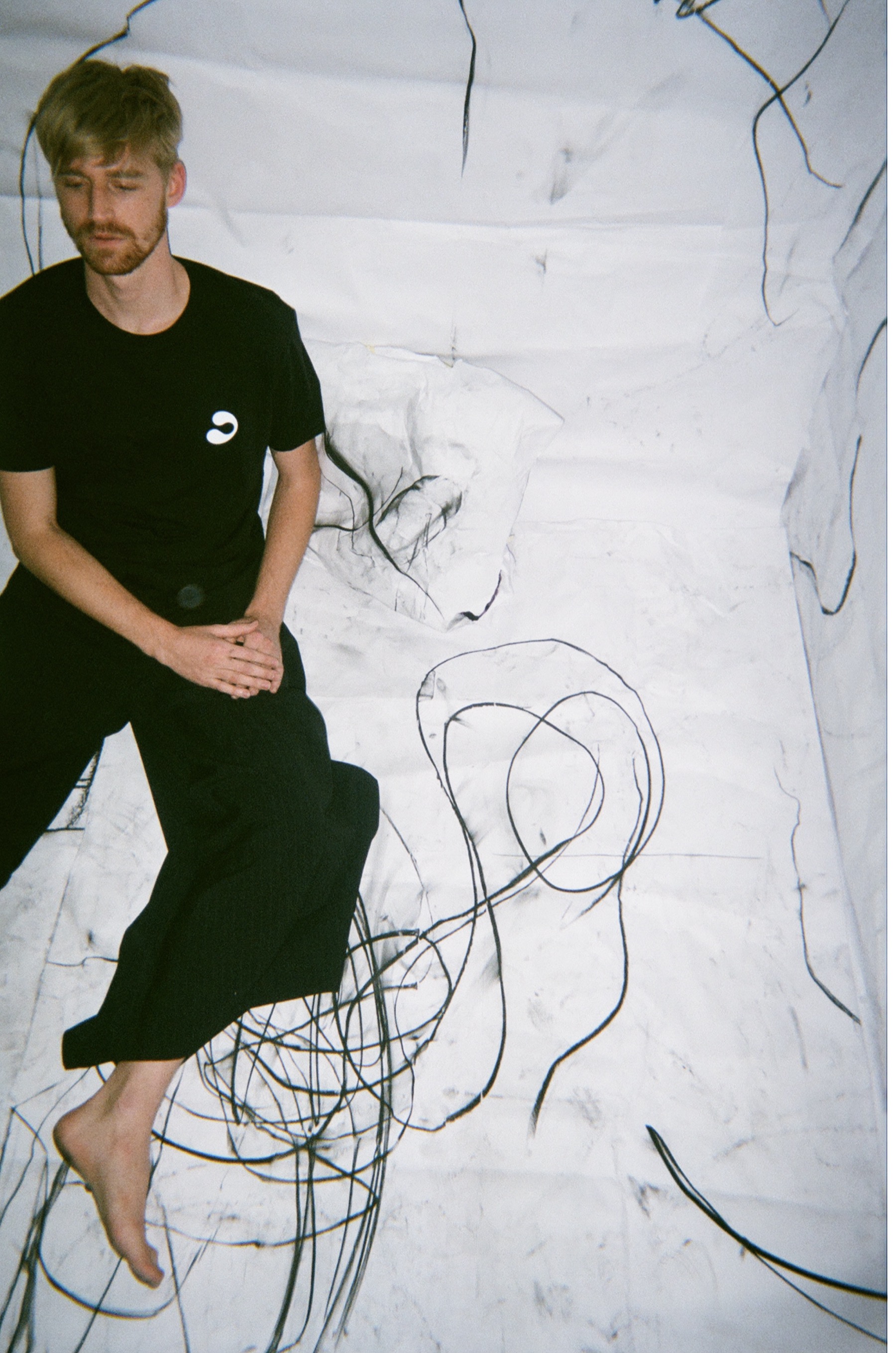 Chad John Payne — charcoal drawing exhibition, paper on floor and walls